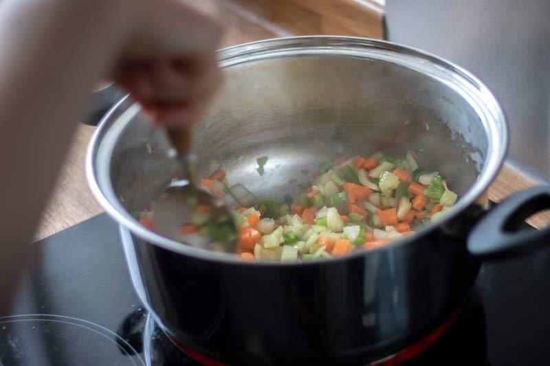 Vegetables frying in pot