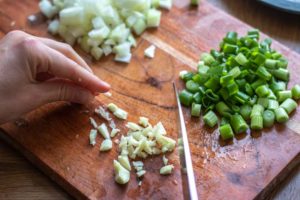 Chopping garlic, spring onion and onion
