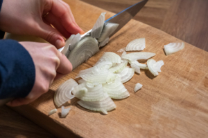 Onion being sliced thinly