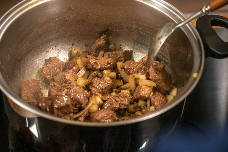 Beef and onions being fried together