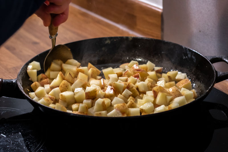 Diced potatoes being fried